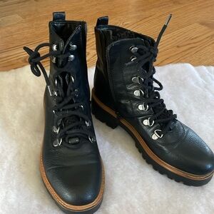 Black leather ankle boots with zippers